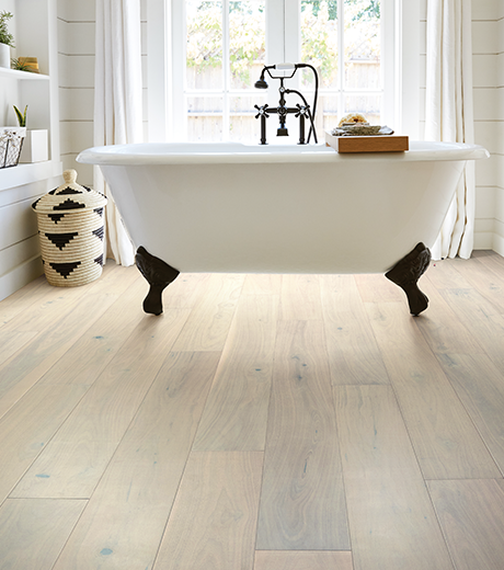 Bathroom with wood-look luxury vinyl flooring from Carpet Sudio & Design Inc. in Los Angeles, CA