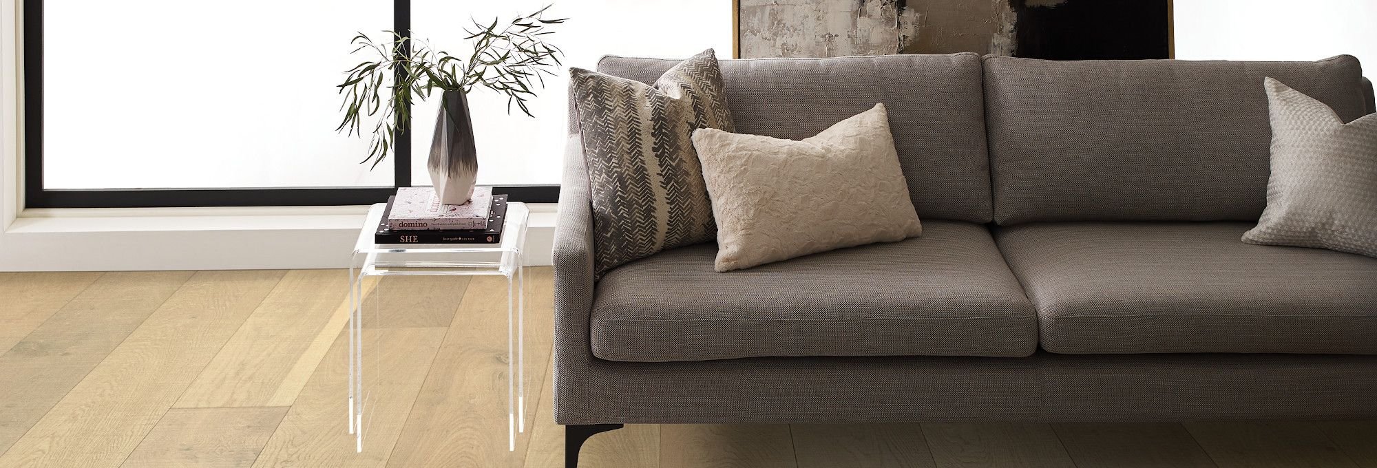 Brown couch on light brown hardwood floor from Carpet Studio & Design Inc. in Los Angeles, CA